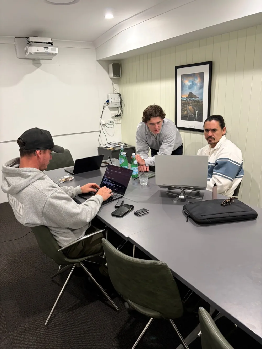 Echelon and a client team working around the table on install day